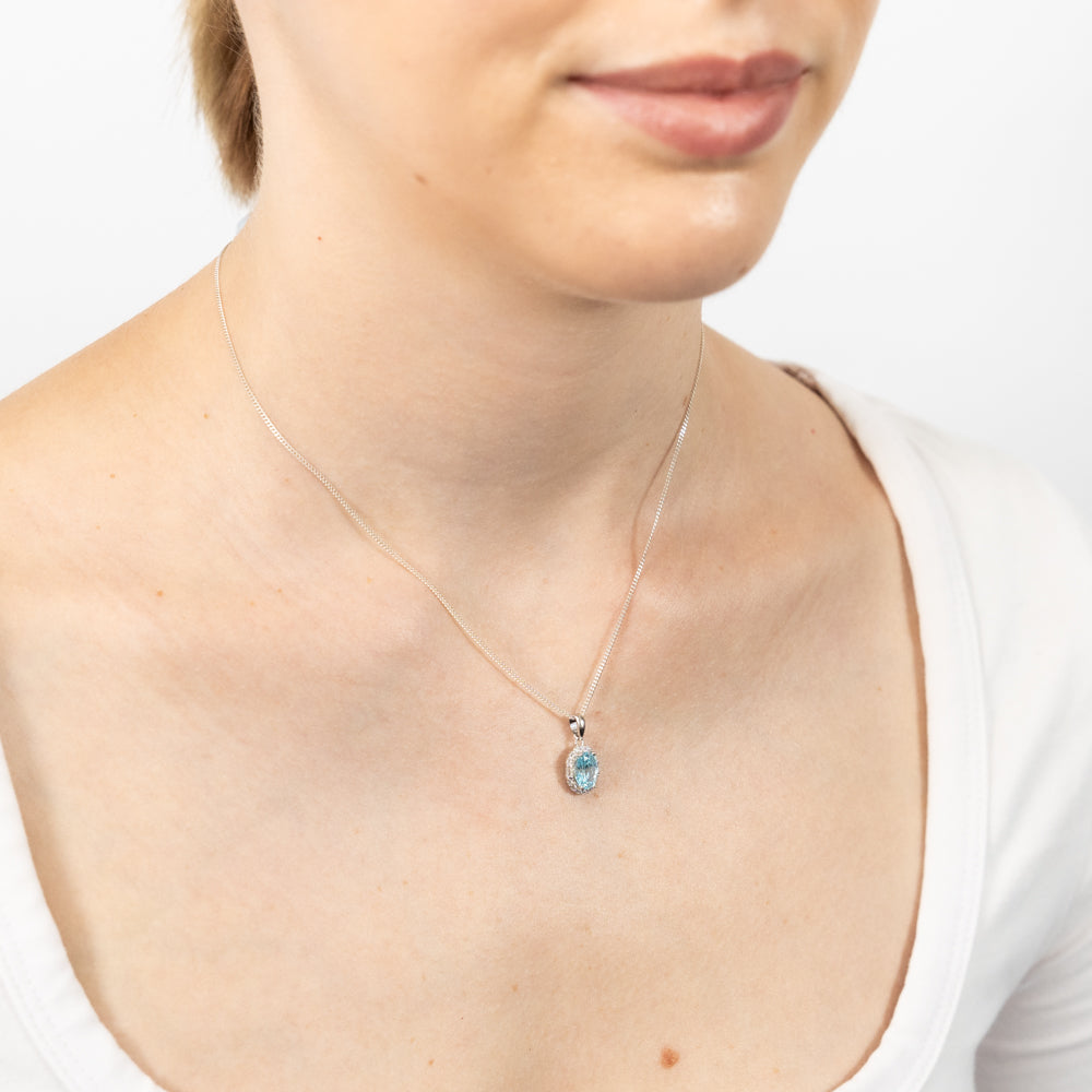 Sterling Silver Rhodium Plated White And Aquamarine Cubic Zirconia Oval Pendant